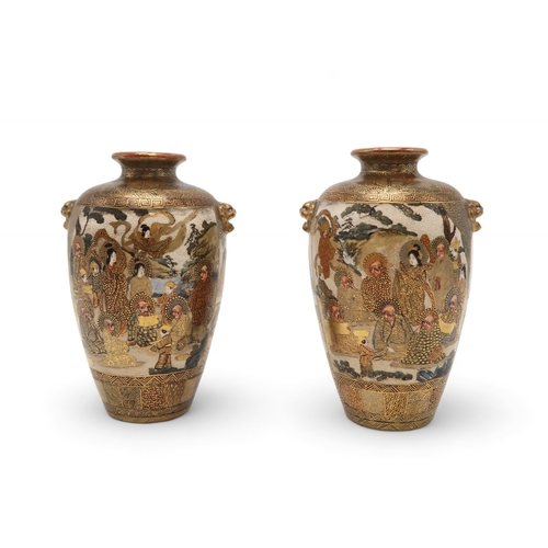 2405 - A PAIR OF SATSUMA BALUSTER VASES Painted with Kannon and ronin deities, with raised masks, signed, 1... 