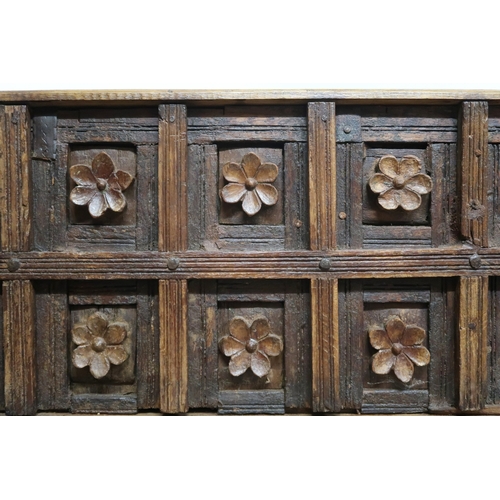 2010 - A LARGE 20TH CENTURY INDIAN HARDWOOD DAMCHIYA DOWRY CHEST panelled back carved with floral moti... 