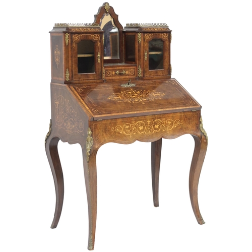 2012 - A 19TH CENTURY LOUIS XV STYLE WALNUT AND SATINWOOD INLAID BUREAU DE DAME desk with brass ormolu... 