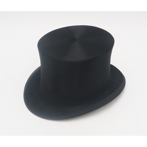 2639 - A SILK TOP HAT BY LINCOLN BENNETT & Co.Of large proportions, approx. size 7 3/8, housed in a car... 