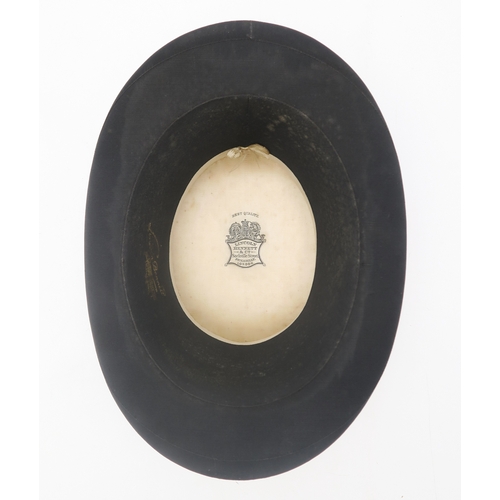 2639 - A SILK TOP HAT BY LINCOLN BENNETT & Co.Of large proportions, approx. size 7 3/8, housed in a car... 