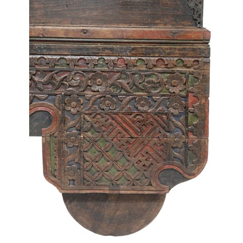 2011 - A 20TH CENTURY INDONESIAN HARDWOOD WHEELED RICE/DOWRY CHESTwith hinged top concealing two candle dep... 