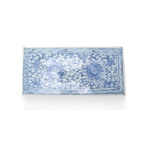 2408 - A CHINESE BLUE AND WHITE PEN BOX Painted with stylised flowers and scrolling foliage, 18cm wide, 8.5... 