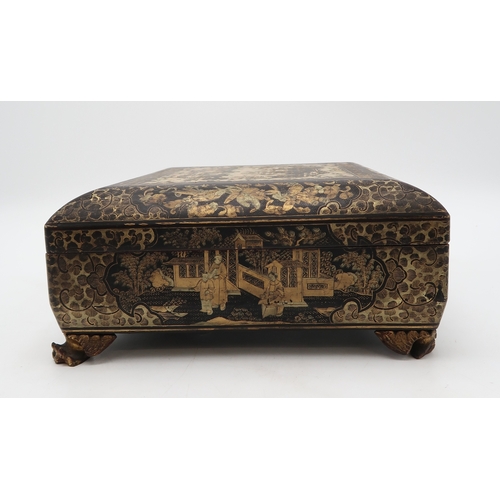 2410 - A CHINESE EXPORT BLACK AND GOLD LAQUERED GAMES BOXDecorated with figures before buildings and within... 