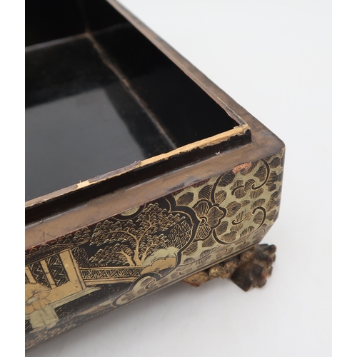 2410 - A CHINESE EXPORT BLACK AND GOLD LAQUERED GAMES BOXDecorated with figures before buildings and within... 