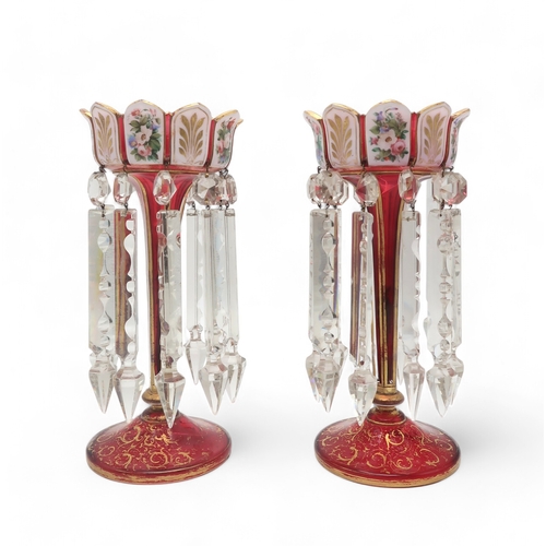 2200 - A PAIR OF BOHEMIAN GLASS LUSTRESin ruby glass, the arch top rim painted with alternating enamel pane... 