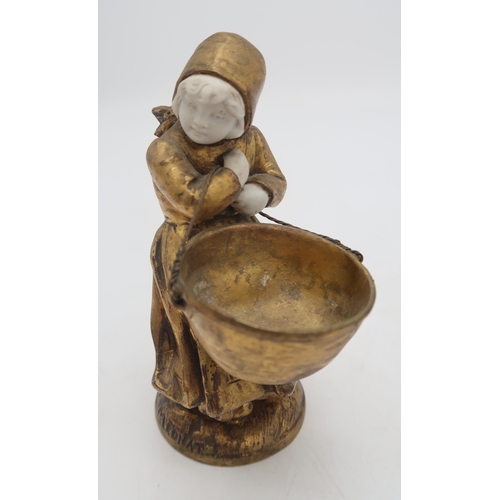 2203 - TWO FRENCH MEDNAT SCULPTURESin gilded metal and bisque porcelain, modelled as a girl carrying a larg... 