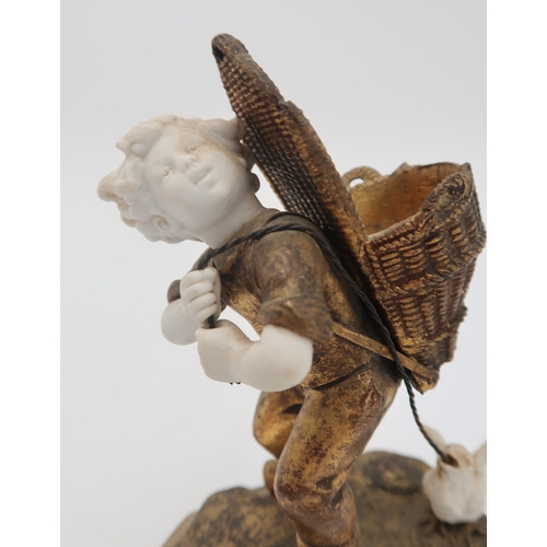 2203 - TWO FRENCH MEDNAT SCULPTURESin gilded metal and bisque porcelain, modelled as a girl carrying a larg... 