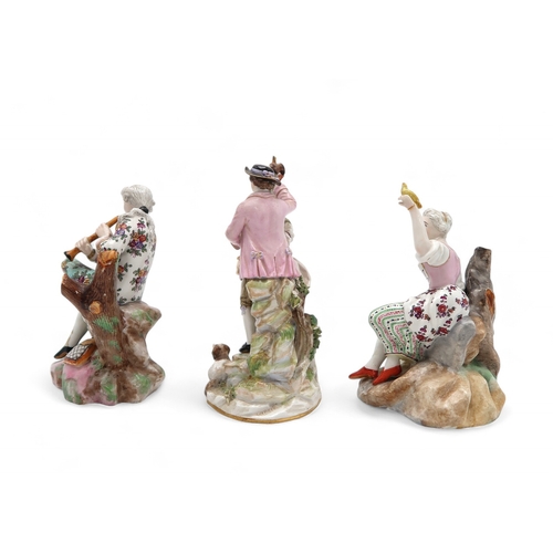 2207 - A GROUP OF MEISSEN FIGURESincluding after Victor Acier, a couple modelled standing with a dog at the... 