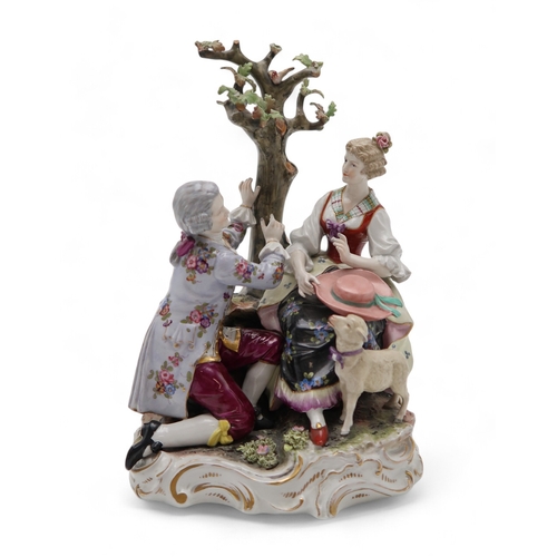 2208 - A MULLER VOLKSTEDT DRESDEN GROUPmodelled as a couple beside a tree with a lamb at their feet, 28cm h... 