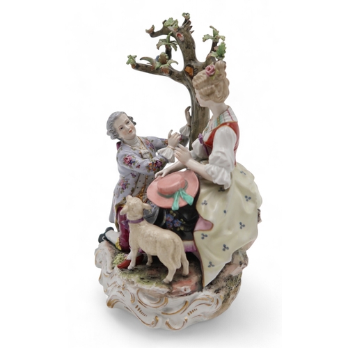 2208 - A MULLER VOLKSTEDT DRESDEN GROUPmodelled as a couple beside a tree with a lamb at their feet, 28cm h... 