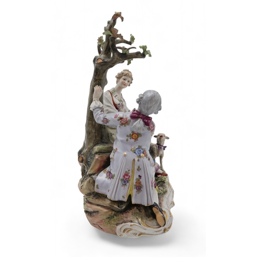 2208 - A MULLER VOLKSTEDT DRESDEN GROUPmodelled as a couple beside a tree with a lamb at their feet, 28cm h... 