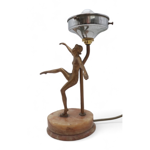 2215 - AN ART DECO GILDED SPELTER LADY LAMPmodelled with arms and one leg raised, upon onyx base, with mott... 