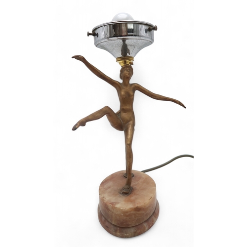 2215 - AN ART DECO GILDED SPELTER LADY LAMPmodelled with arms and one leg raised, upon onyx base, with mott... 