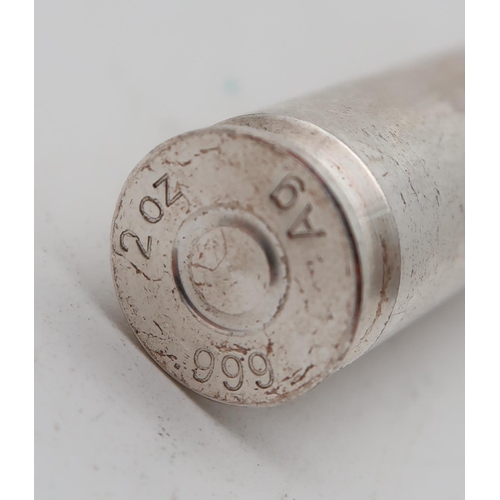 403 - A 999 silver model of a bullet, 62gms 