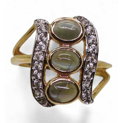 745 - An alexandrite and zircon ring, mounted in 9ct gold, the three cats eye alexandrites are approx... 