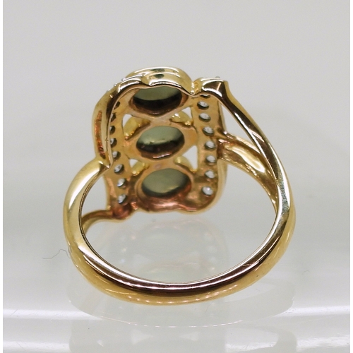 745 - An alexandrite and zircon ring, mounted in 9ct gold, the three cats eye alexandrites are approx... 