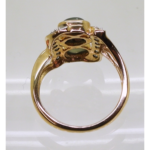 745 - An alexandrite and zircon ring, mounted in 9ct gold, the three cats eye alexandrites are approx... 