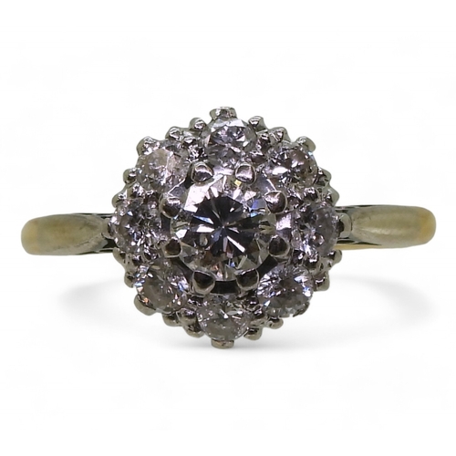 814 - A diamond cluster ring, the 18ct yellow gold and platinum mount is set with estimated approx 0.50cts... 