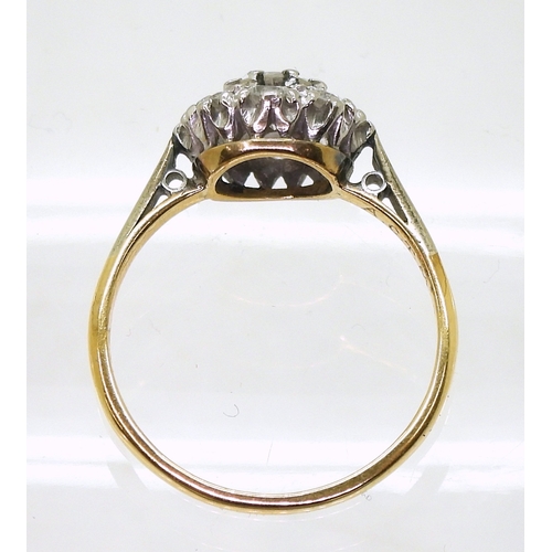 814 - A diamond cluster ring, the 18ct yellow gold and platinum mount is set with estimated approx 0.50cts... 