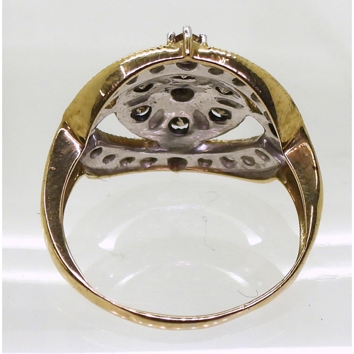 767 - A yellow metal ring set with champagne and white diamonds, set with estimated approx 0.65cts of bril... 