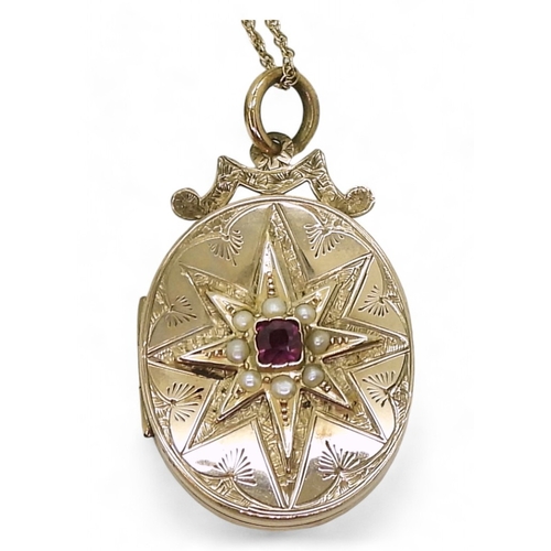 769 - A decorative locket, the yellow metal locket is engraved with a star to the front, set with split pe... 