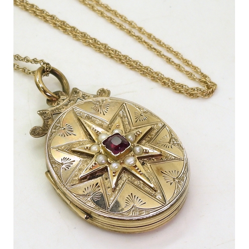 769 - A decorative locket, the yellow metal locket is engraved with a star to the front, set with split pe... 