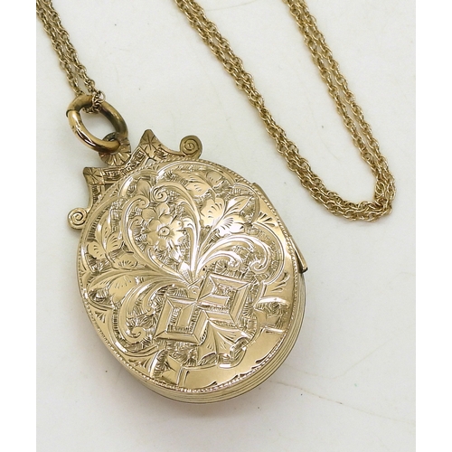 769 - A decorative locket, the yellow metal locket is engraved with a star to the front, set with split pe... 