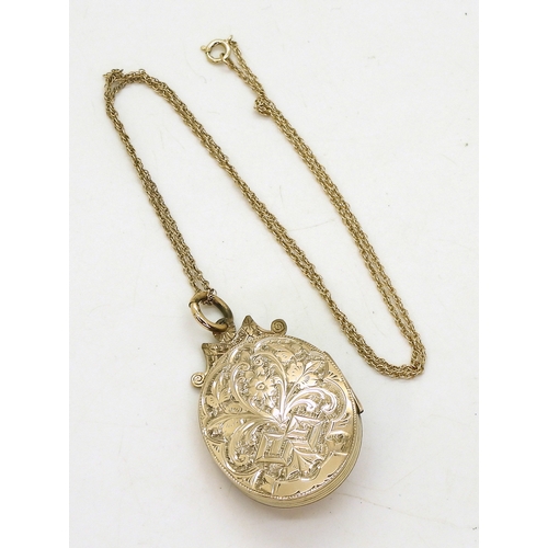 769 - A decorative locket, the yellow metal locket is engraved with a star to the front, set with split pe... 