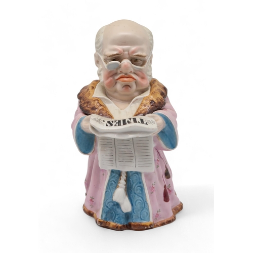 216 - A continental tobacco jar, modelled as a man reading The Times