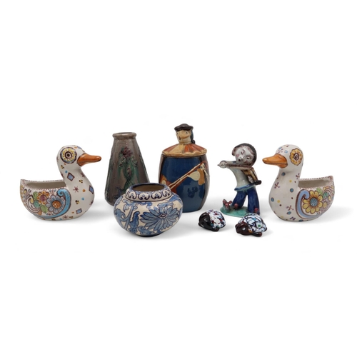 234 - A Walter Bosse ceramic figure of a violin player, an Arts and Crafts tube line decorated vase, a han... 