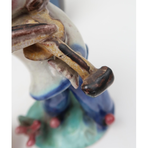 234 - A Walter Bosse ceramic figure of a violin player, an Arts and Crafts tube line decorated vase, a han... 