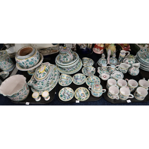 243 - An extensive matched Deruta breakfast, tea and dinner service with cups and saucers, mugs, teapot, c... 