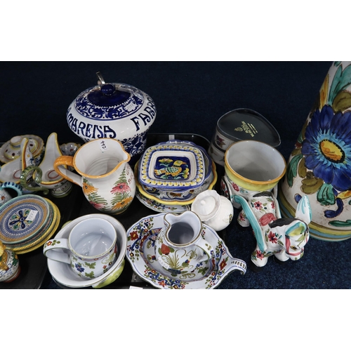 244 - A collection of Italian faience pottery including mugs, candlestands, dishes etc