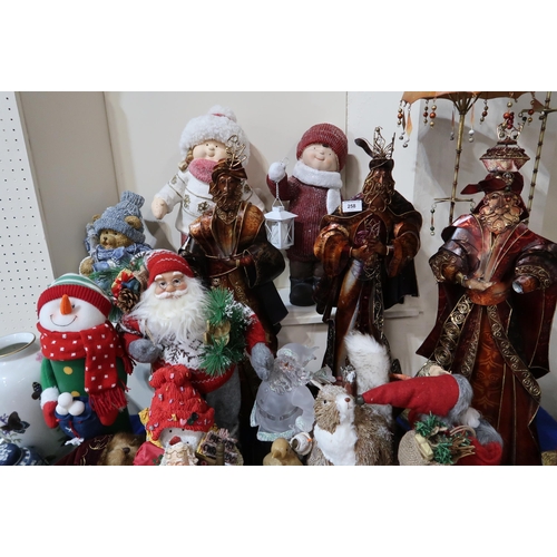 258 - A collection of Christmas ornaments, including nativity figures, Father Christmas's snowmen etc ... 