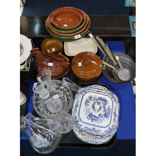 264 - A graduated set of copper frying pans, terracotta oven dishes and a hen egg nest