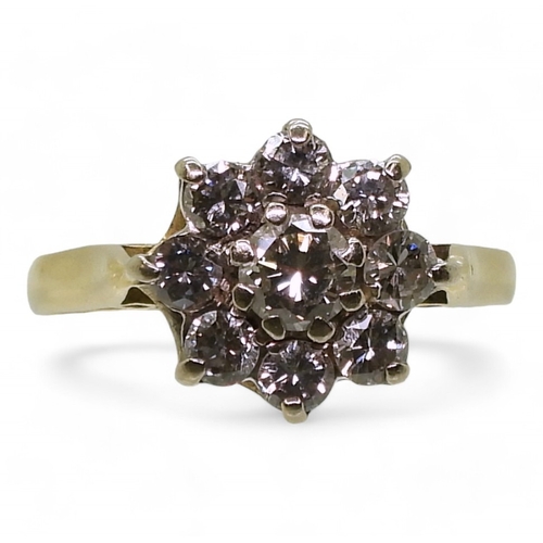 802 - A diamond flower ring, set with estimated approx 0.70cts of brilliant cut diamonds, finger size O1/2... 