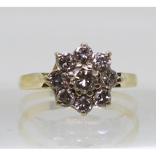 802 - A diamond flower ring, set with estimated approx 0.70cts of brilliant cut diamonds, finger size O1/2... 