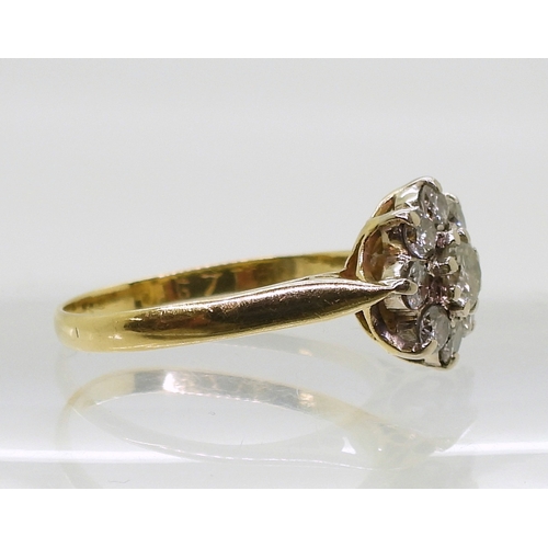 802 - A diamond flower ring, set with estimated approx 0.70cts of brilliant cut diamonds, finger size O1/2... 