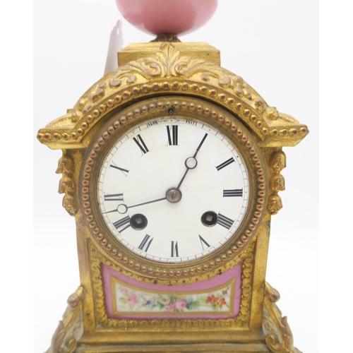 204 - A French mantel clock, with pink porcelain panel and finial, the white enamel dial with roman numera... 