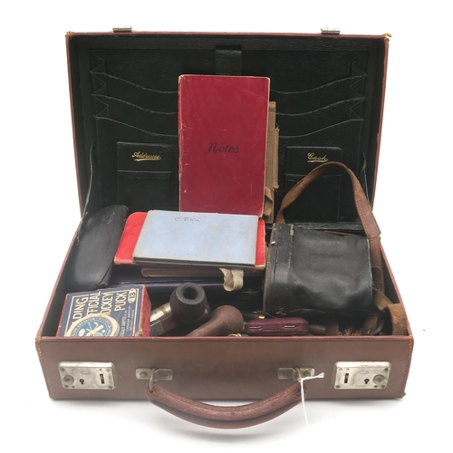 512 - A small tan leather attache case, with green Morocco lining; containing a Mabie Todd & Co. 