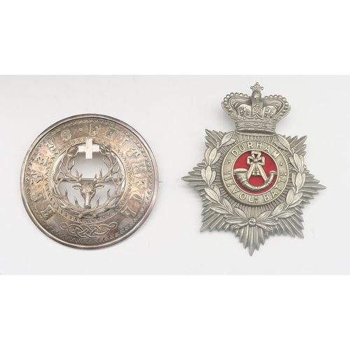 516 - A 1st Volunteer Battalion Durham Light Infantry helmet plate; together with a large 