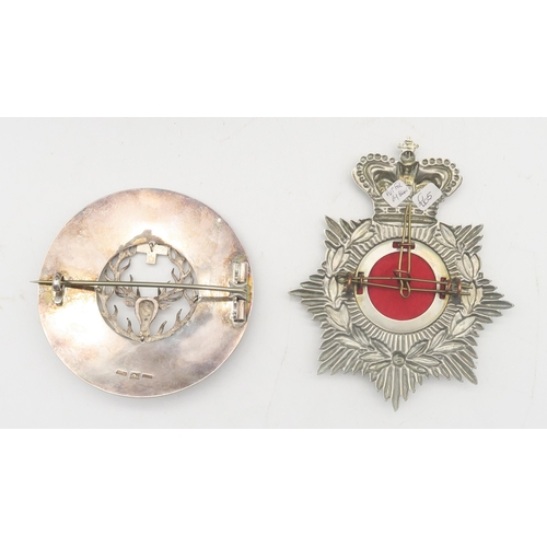 516 - A 1st Volunteer Battalion Durham Light Infantry helmet plate; together with a large 