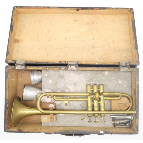 545 - A brass trumpet with three mouthpieces and two mutes within a wooden box; together with a small coll... 