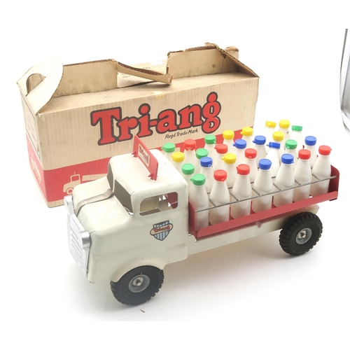 547 - A boxed Tri-ang milk float, with a full compliment of bottles