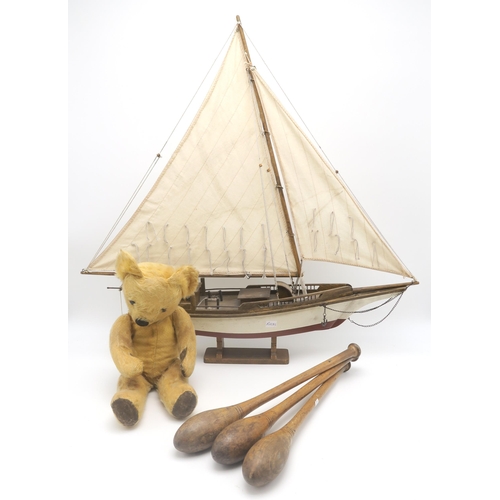 556 - A large model sailing yacht, measuring approx. 64cm from tip of bowsprit to stern; a set of three In... 