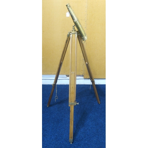 560 - A pair of modern brass decorative binoculars, mounted upon a hardwood tripod, measuring approx. 125c... 