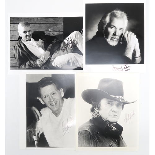 563 - AUTOGRAPHSSigned black and white photographs of country music stars Johnny Cash and Kenny Rogers; ro... 