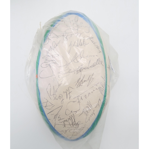 571 - A Gilbert 1995 Rugby World Cup official match ball, bearing numerous player signatures; together wit... 