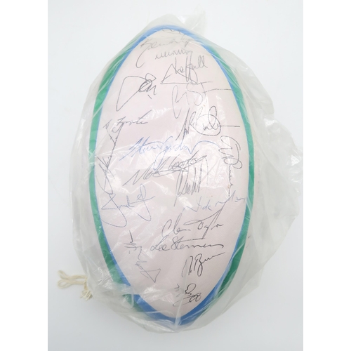 571 - A Gilbert 1995 Rugby World Cup official match ball, bearing numerous player signatures; together wit... 